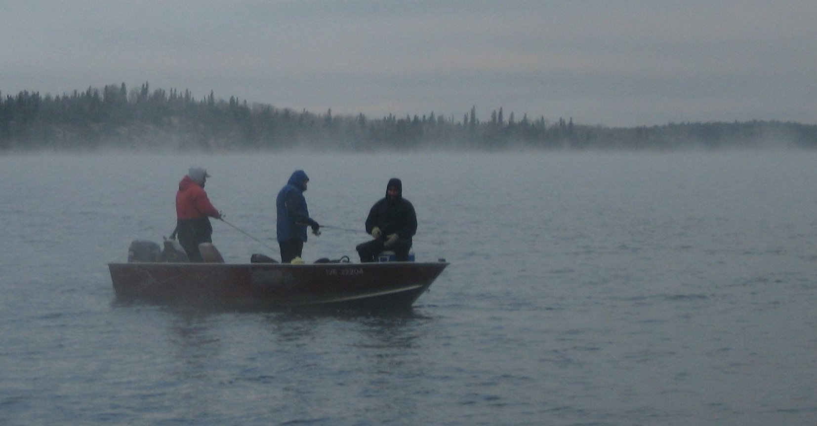 Early morning jigging for walleyes. Yep, it's cold. Photo by Bill Schneider.